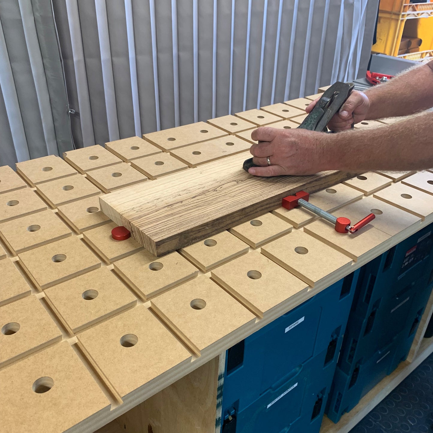 HDS Workbench Top – flattening a board with a Stanley plane on the hold down system workbench top, made in the UK