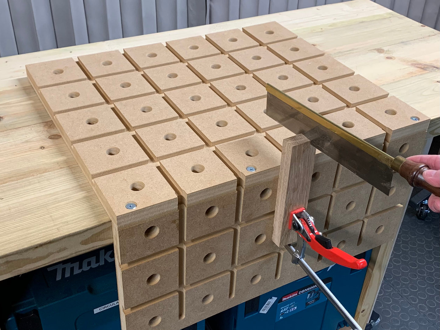 Woodworker using a gentleman saw Cutting a piece of oak clam by The HDS hold down system