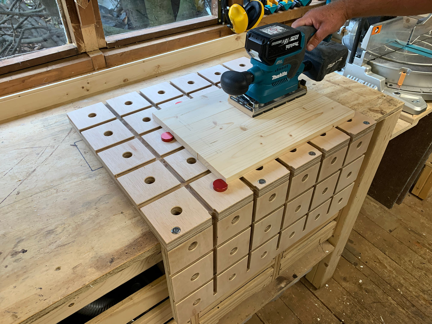 Using bench dogs and a dog clamp in the Grade B HDS Hold Down System whilst sanding with the Makita DBO380Z Orbital Sander