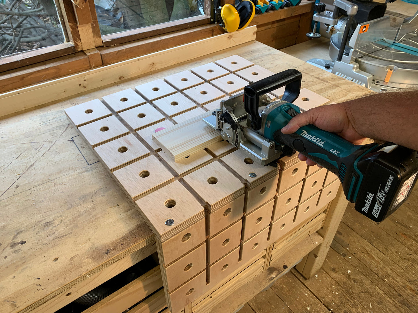 Grade B HDS Hold Down System holding the workpiece securely whilst using the Makita DPJ180Z Biscuit Jointer to cut slots for biscuits