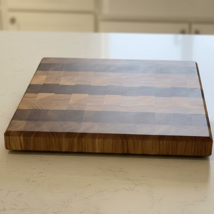And grain cutting board made from walnut oak and ash