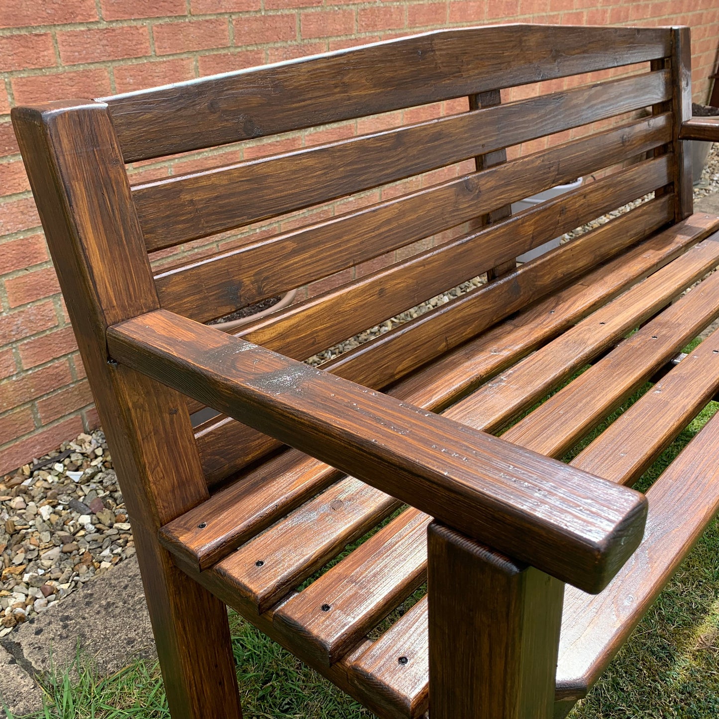 Handmade dark oak bench seat and backrest detail
