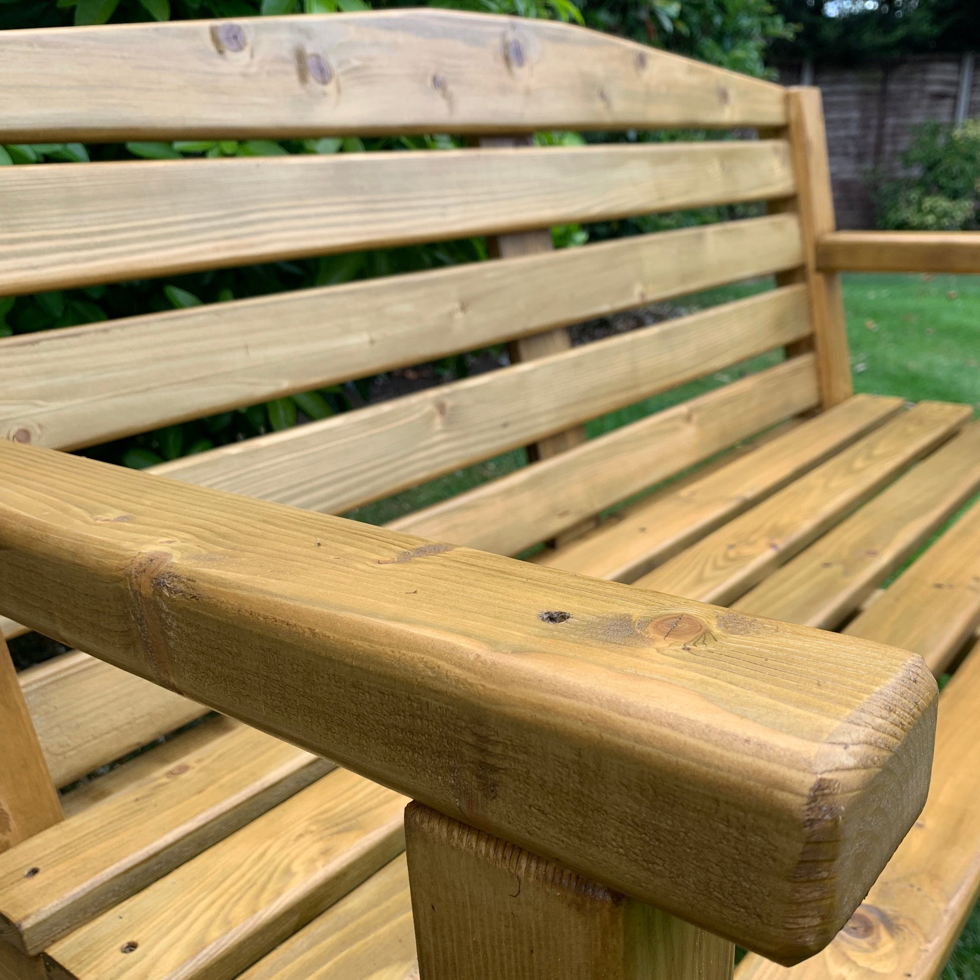Close-up of a wooden bench handmade finished in medium oak