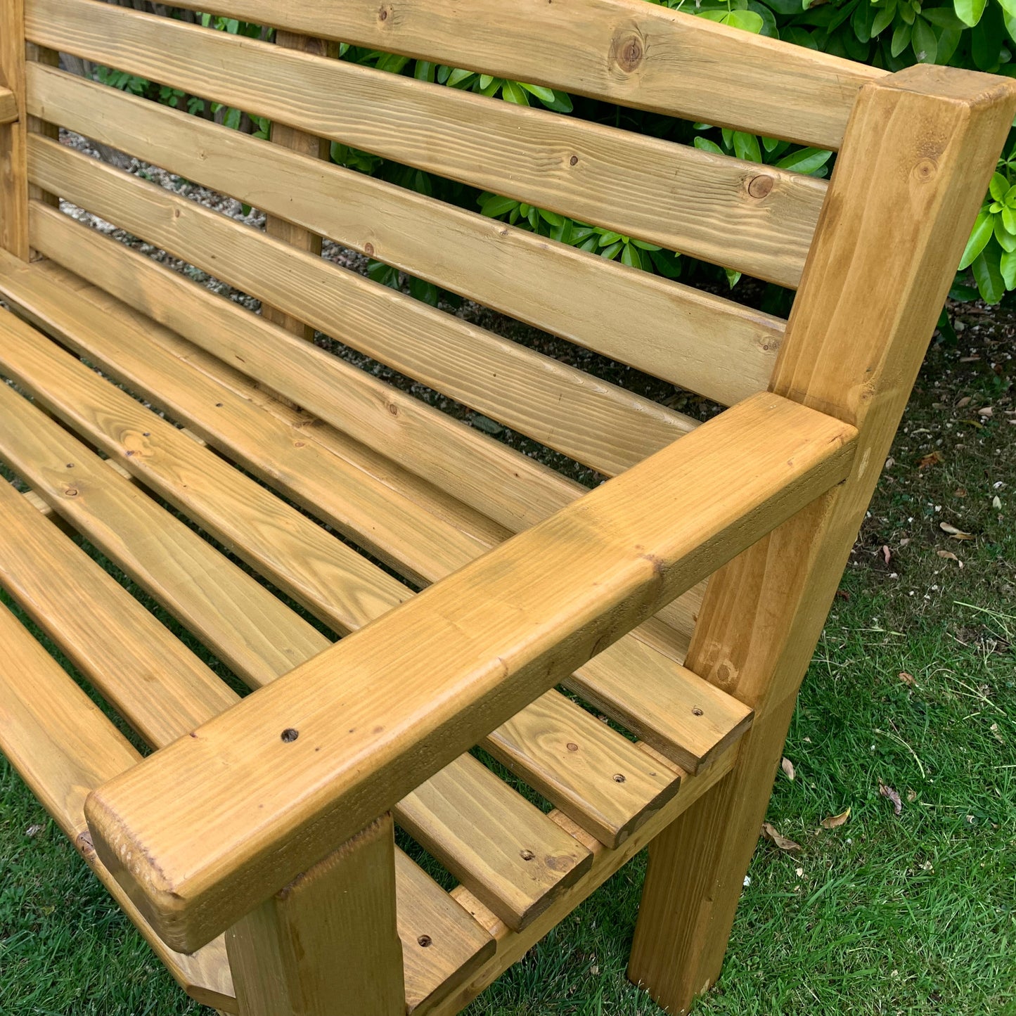 Medium oak garden bench close-up, pressure-treated timber