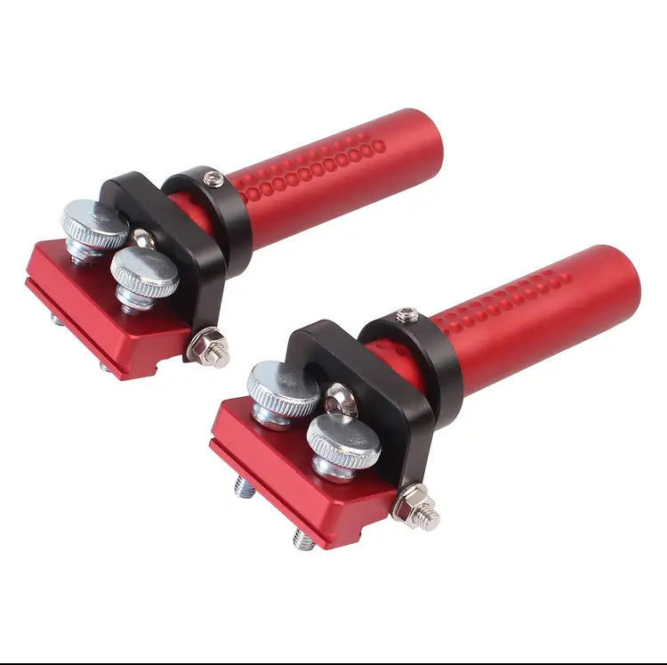 Pair of red HDS bench dogs with hinged track-saw rail fittings on a white background.