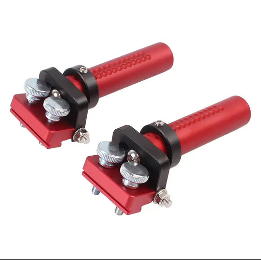 Pair of red HDS bench dogs with hinged track-saw rail fittings on a white background.