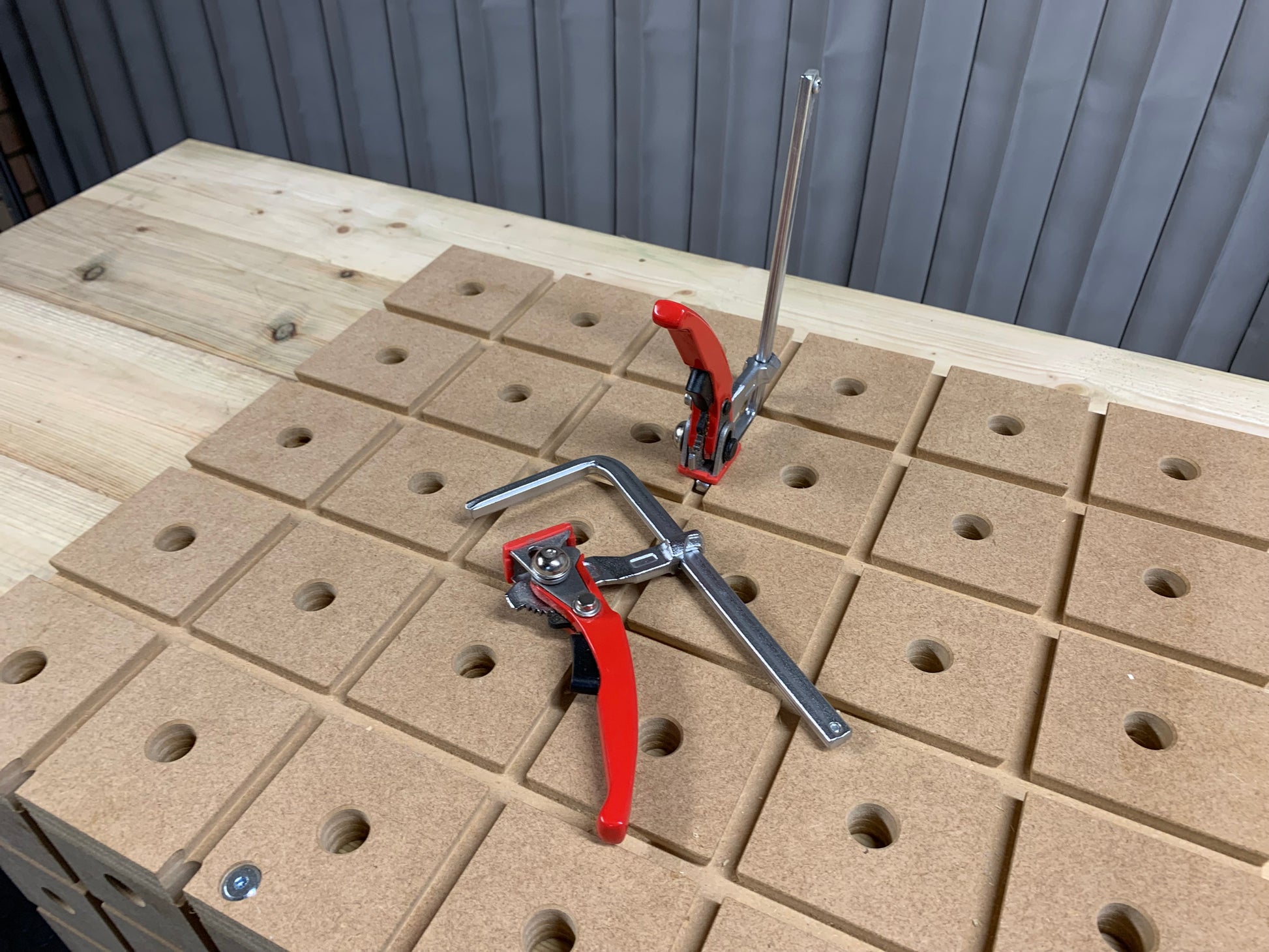 HDS wooden work station with with quick clamps on a workshop bench