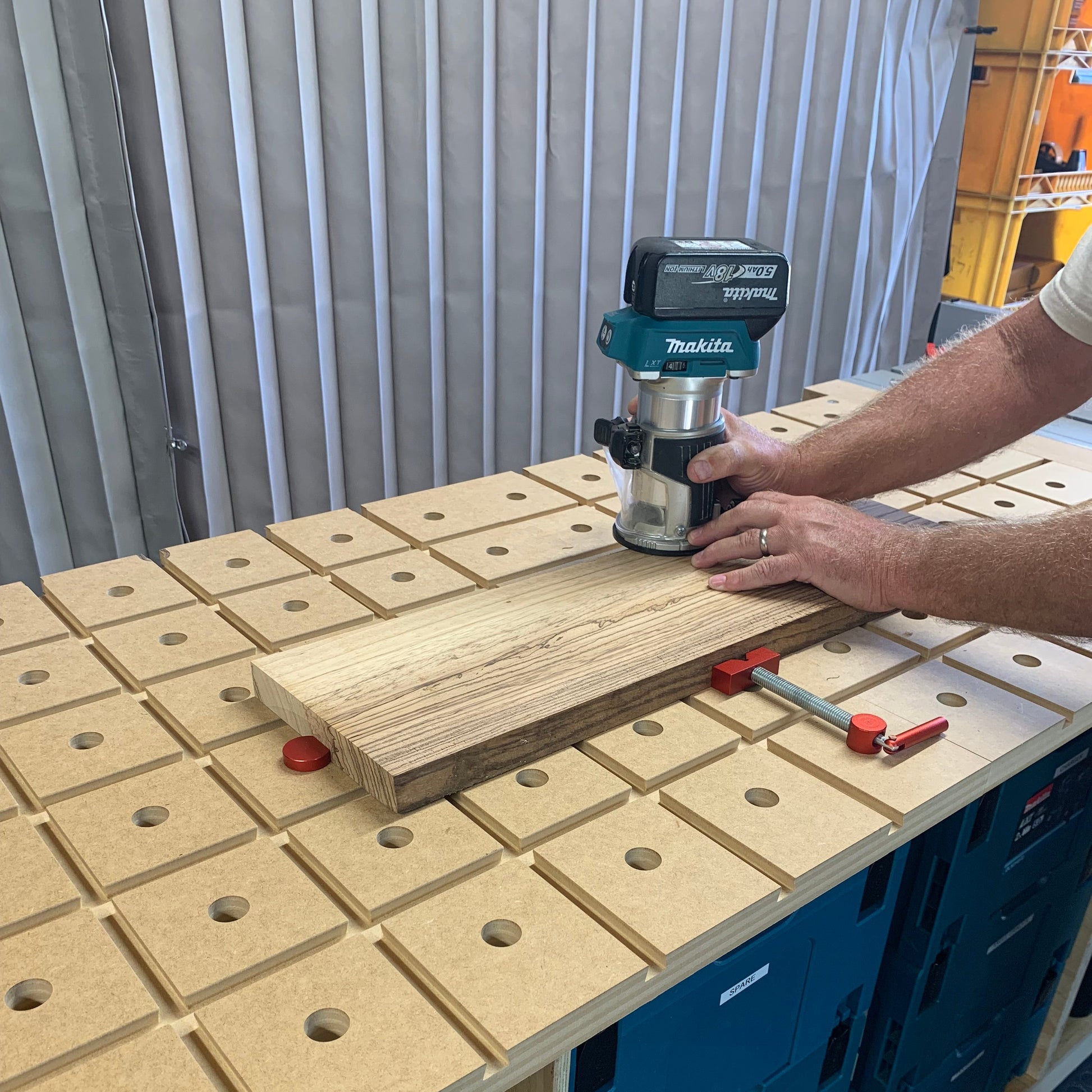 HDS Workbench Top – Makita trim router used on a board clamped flat to the hold down system workbench top, made in the UK