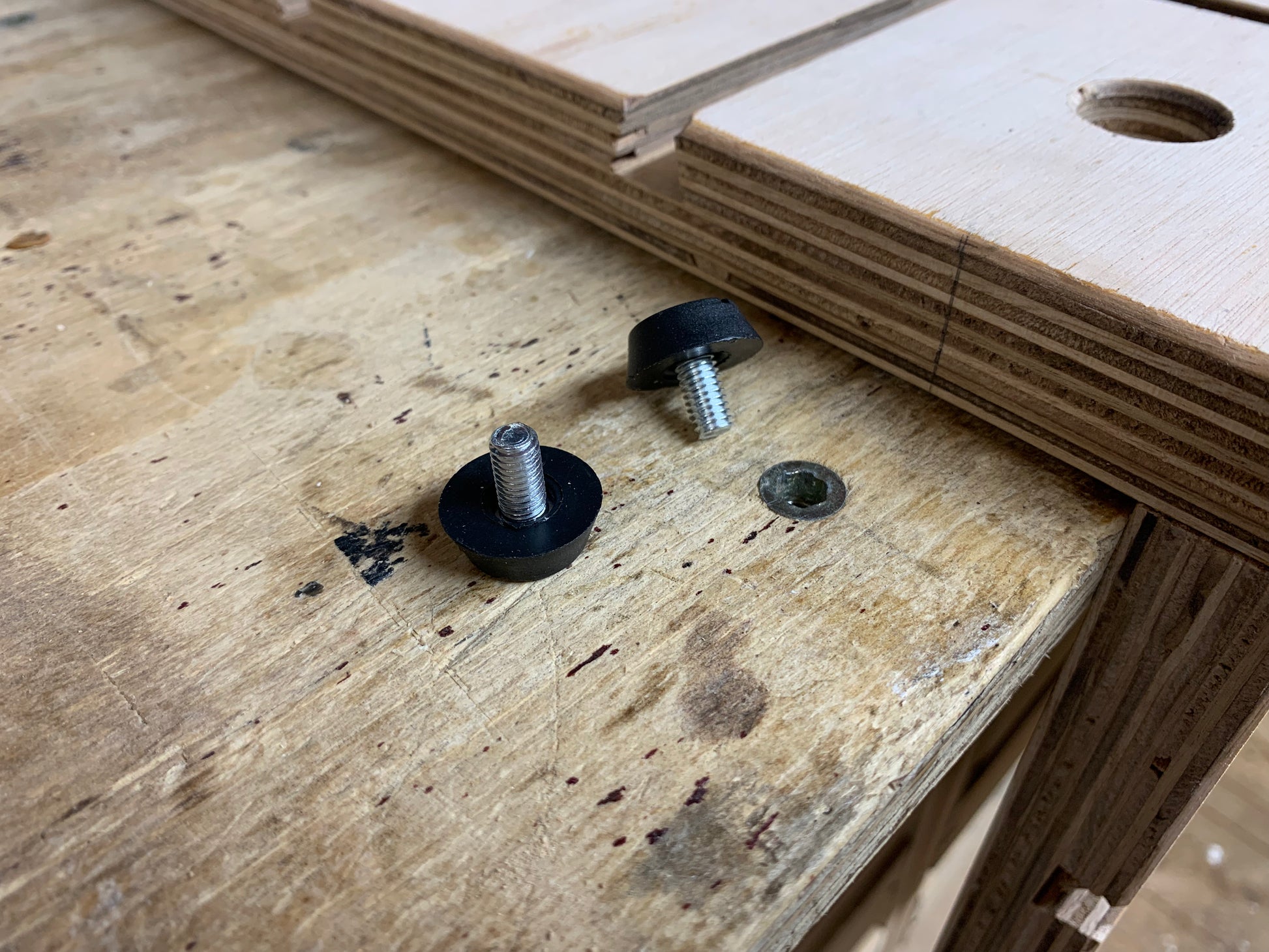 Two HDS anti-slip plugs On a workbench ready to be installed into the threaded insert