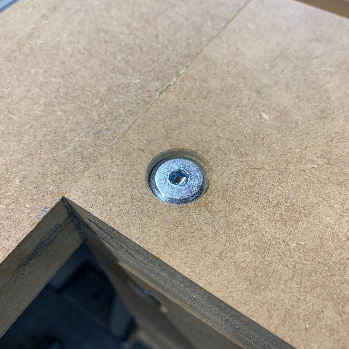HDS button-top bolt fitted flush into a countersunk hole on an HDS Workbench Top