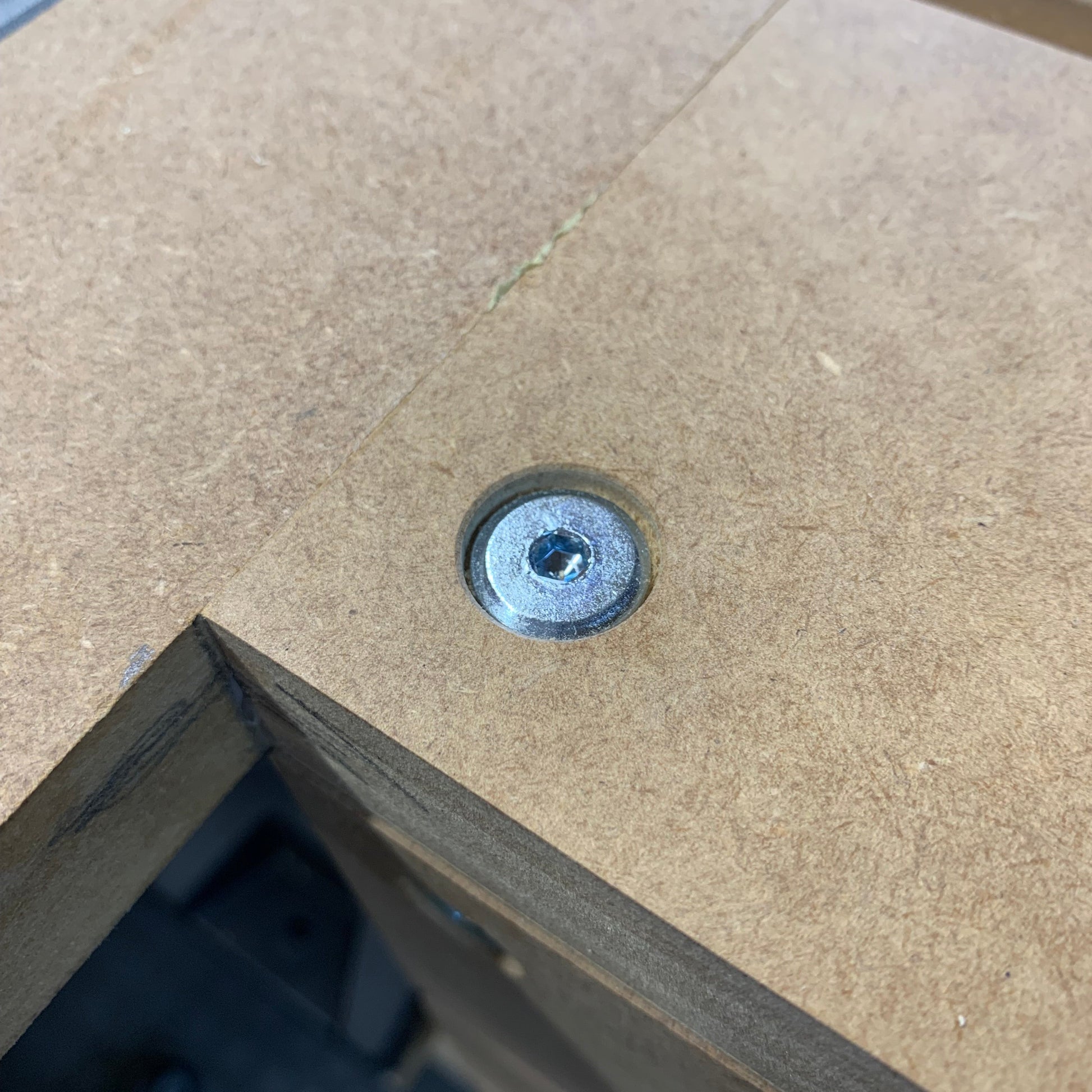 HDS button-top bolt fitted flush into a countersunk hole on an HDS Workbench Top