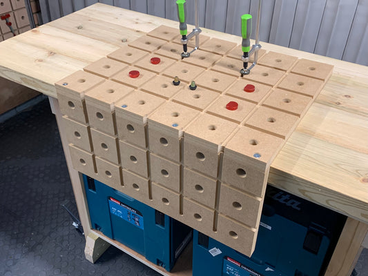 HDS premium pack on a workshop bench with two track clamps four bench dogs and And anti slip plugs