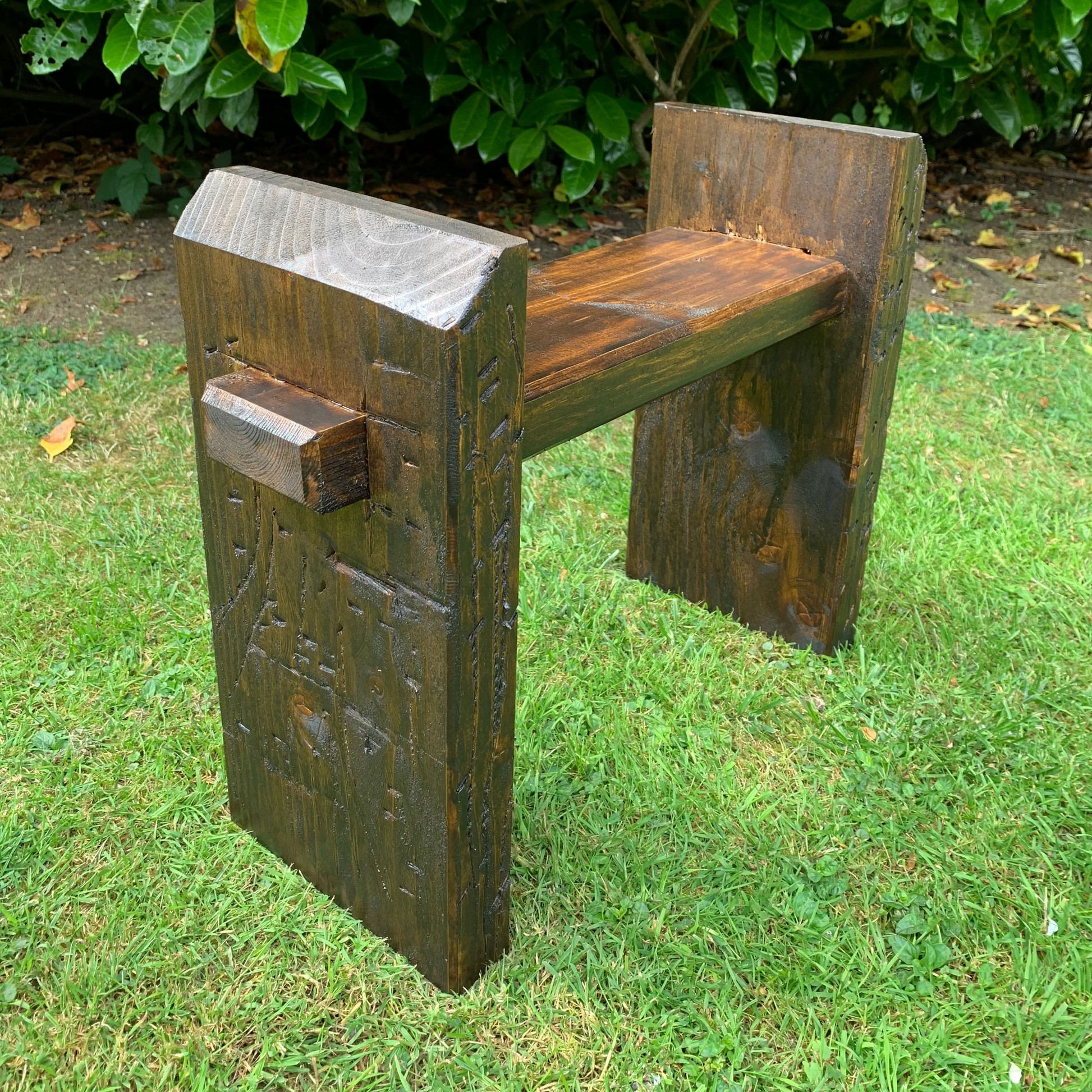 Dark oak sleeper bench leg detail, handmade joinery