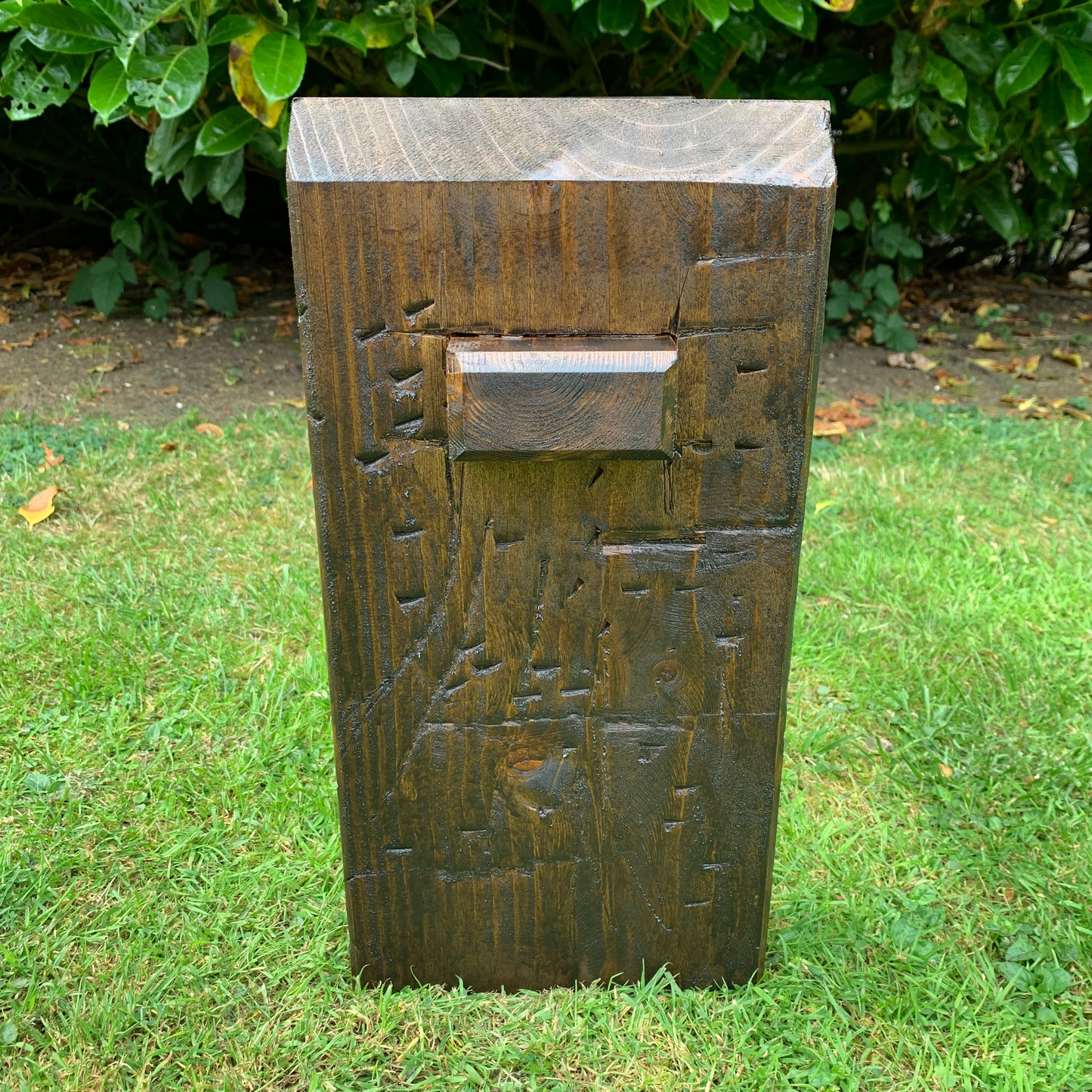 Dark oak sleeper bench leg detail, handmade joinery end on