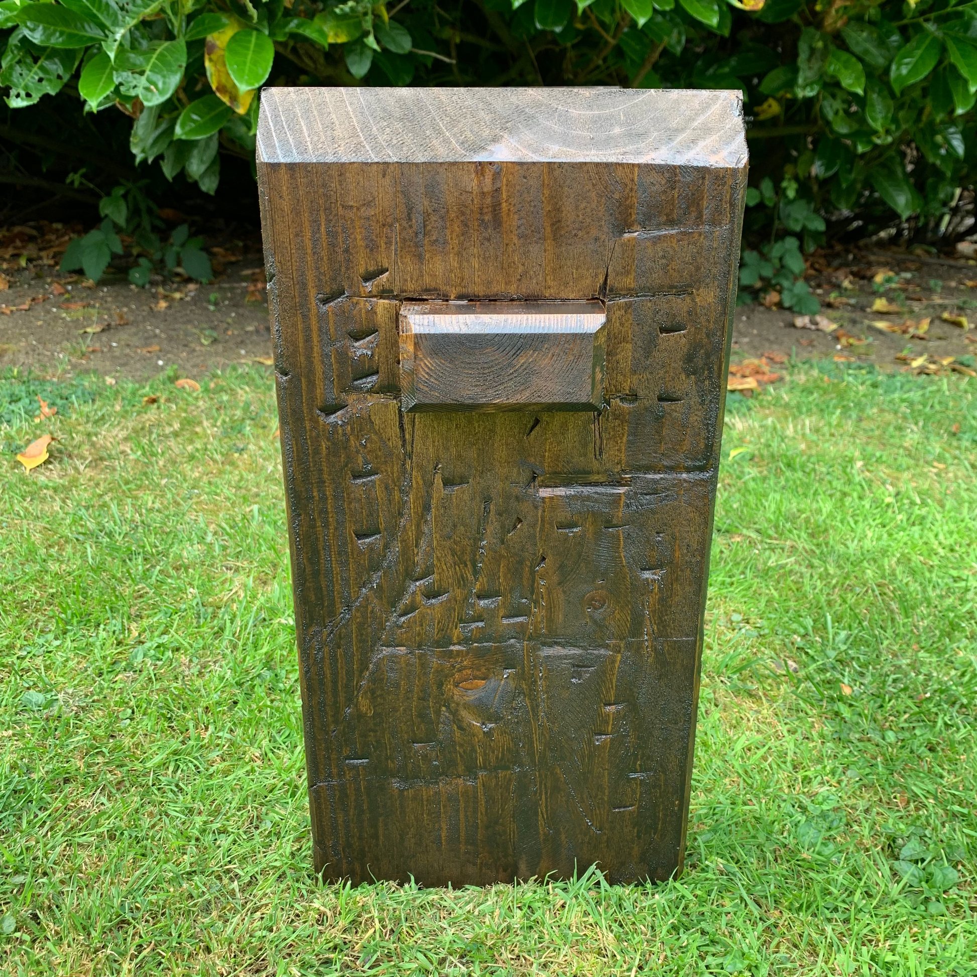Dark oak sleeper bench leg detail, handmade joinery end on