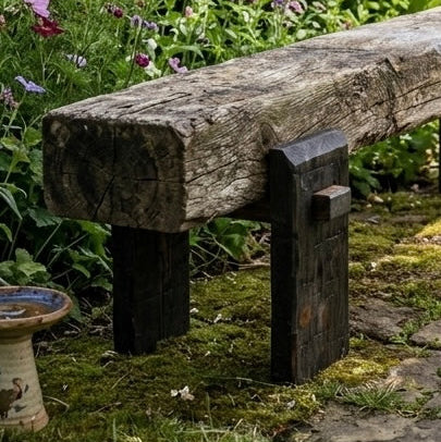  Dark oak sleeper bench legs in garden with bird bath