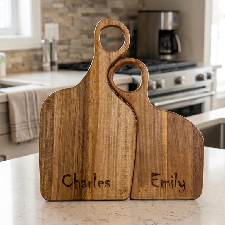 Personalised Yin Yang wooden charcuterie board set with engraved names, two interlocking wood boards on kitchen counter