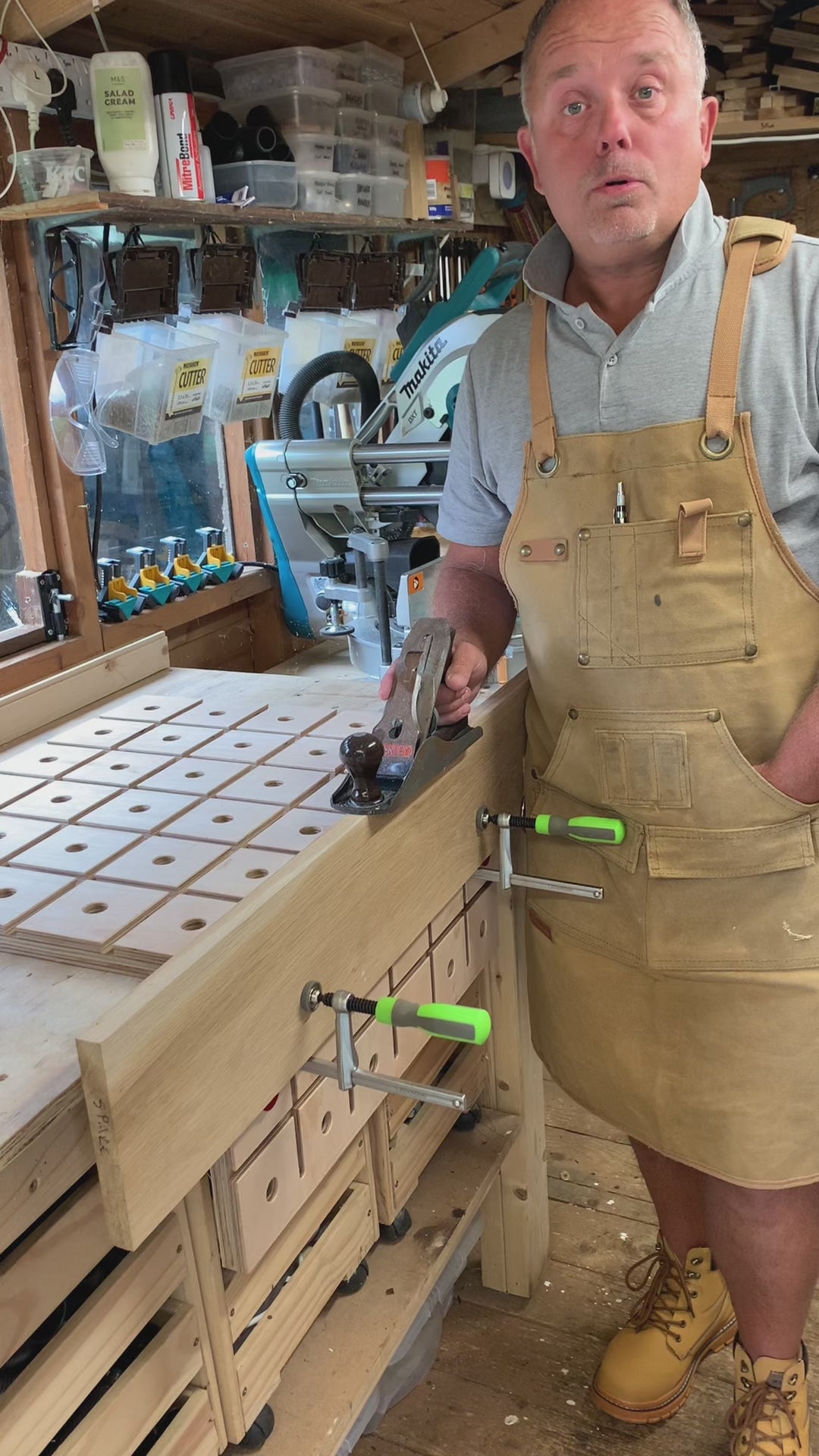 Video showing a woodworker securing a portable MFT style workbench to his bench